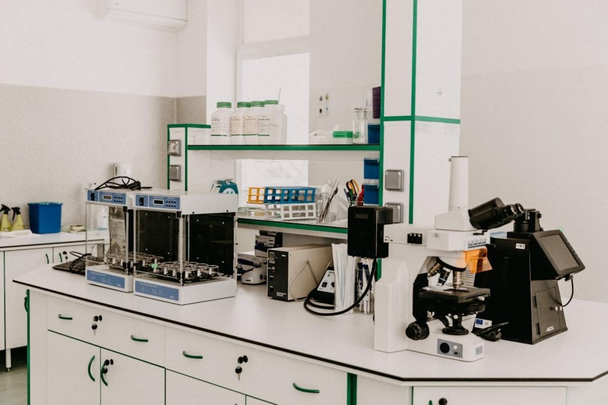 a scientist analyzing plant extracts in a modern laboratory, with European botanical samples and advanced organic synthesis equipment